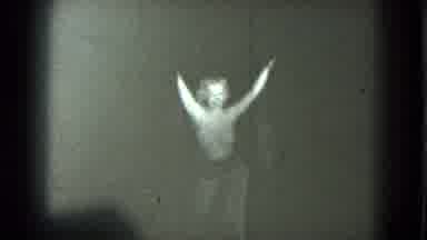 San Francisco California-1975: Woman Sways and Steps Back as Curtains Close