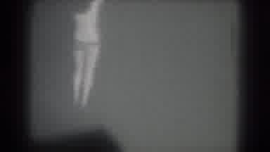 San Francisco California (1975): Scantily Clad Woman Turns In Circle Before