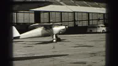 Harrisburg Pennsylvania USA-1975: Planes At The Airport Park And Taxi Down The Runway