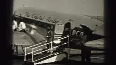 Harrisburg Pennsylvania USA (1975): People Getting Out Of An Airplane And Workers