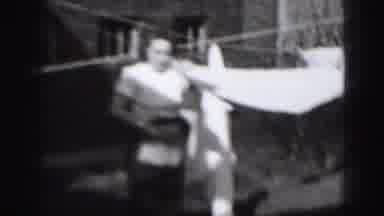 Harrisburg Pennsylvania USA (1975): Woman Using Clothespins To Hang Laundry