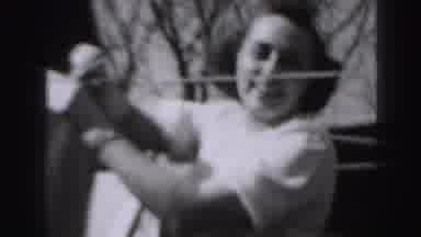 Harrisburg Pennsylvania USA (1975): Woman Wearing White Shirt Takes Laundry Off
