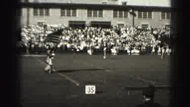 Harrisburg Pennsylvania USA (1975): Marching Band Marching Onto A Football Field