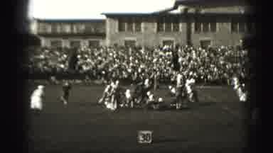 Harrisburg Pennsylvania USA (1975): People Watching A Football Game Play At 30