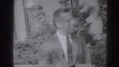 Harrisburg Pennsylvania USA (1975): Man In Suit Talking To Another Man