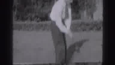 Harrisburg Pennsylvania USA (1975): Young Gentleman Firmly Swinging A Golf Club In