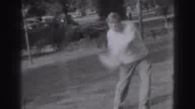Harrisburg Pennsylvania USA (1975): A Men Is Practicing The Golf With His Friend