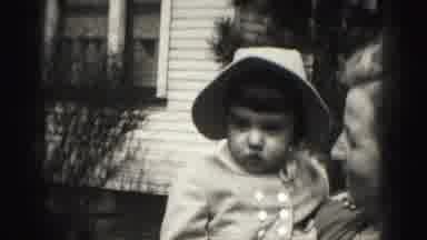 Harrisburg Pennsylvania USA (1975): Lady Holding A Baby That Is Picking Her Nose