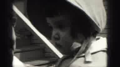 Harrisburg Pennsylvania USA (1975): Unimpressed Toddler In Bonnet Being Held By