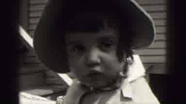 Harrisburg Pennsylvania USA (1975): Mother Holds Up Baby To The Camera And Baby