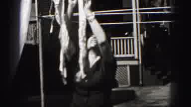 Harrisburg Pennsylvania USA (1975): Woman Laughing While Hanging A Few Bras On The