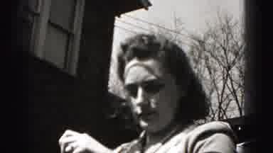Harrisburg Pennsylvania USA (1975): Woman In A Dress Talks To The Camera As She