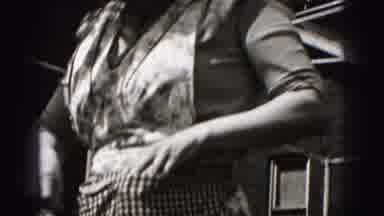 Harrisburg Pennsylvania USA (1975): Woman In Flowered Apron Wearing Dress Outside