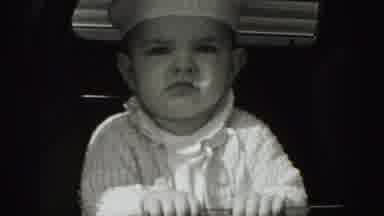 Harrisburg Pennsylvania USA (1975): A Baby Wearing A White Knitted Sweater