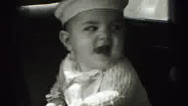 Harrisburg Pennsylvania USA (1975): A Child Being Held By His Mother In The