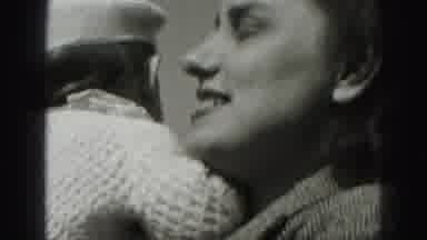 Harrisburg Pennsylvania USA (1975): A Young Mother Holding Her Baby And Giving Her