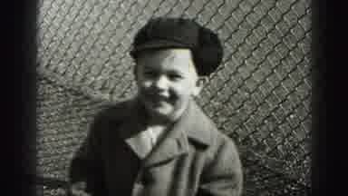 Harrisburg Pennsylvania USA (1975): Young Boy With A Hand And Coat On Standing