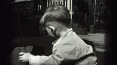 Harrisburg Pennsylvania USA (1975): A Young Boy Is Being Filmed While He Is