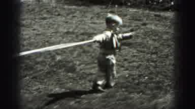Harrisburg Pennsylvania USA (1975): Little Boy In A Heavy Coat Plays With White