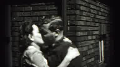 Harrisburg Pennsylvania USA (1975): Adorable Young Couple Kissing Outside Of A