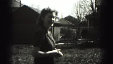 Harrisburg Pennsylvania USA (1975): Woman Standing In Yard On Grass Hand In Hand