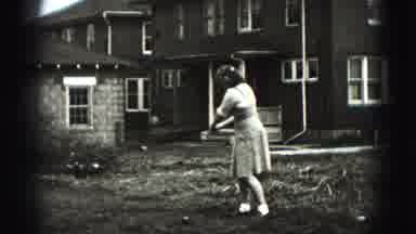 Harrisburg Pennsylvania USA (1975): A Lady Playing Golf In Her Yard Black And