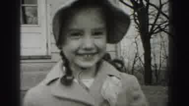 Harrisburg Pennsylvania USA (1975): A Little Girl Smiling And Two Women Walking