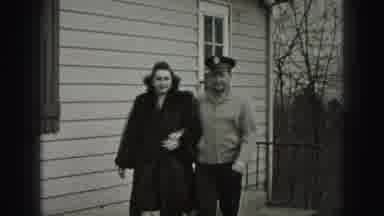 Harrisburg Pennsylvania USA (1975): Man In Uniform Escorts A Woman Down The