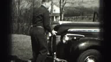 Harrisburg Pennsylvania USA (1975): Man Fixing Car