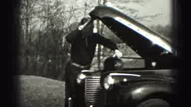 Harrisburg Pennsylvania USA (1975): A Serviceman Trying To Fix An Old Broken Down