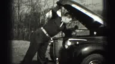 Harrisburg Pennsylvania USA (1975): Checking Out The Engine On An Old Car Outside