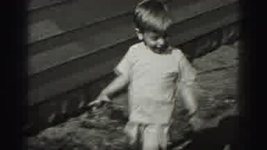 Harrisburg Pennsylvania USA (1975): A Boy And Girl Playing With Joyfully Jump In