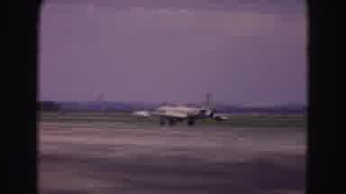 Washington DC (1975): Shot Of Airplane Slowly Moving Down Runway Then Another