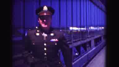 Washington DC (1975): An Officer Turning To The Camera And Taking Something From
