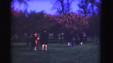 Washington DC (1975): People Walking On A Park Beside A Road Where Few Old Cars