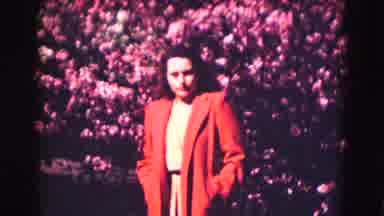 Washington DC (1975): Woman In A Red Coat In A Garden