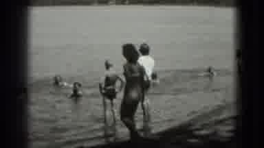 Washington DC (1975): Lots Of People Ranging In Age Swimming At A Sandy Beach On A