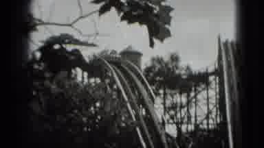 Washington DC (1975): A View Of People Riding On Roller Coaster And An Airplane
