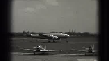 Washington DC (1975): Airplane Taxiing Down The Runway At An American Military