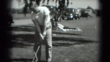 Washington DC (1975): Man In White Shirt And Pants Plays Golf And Swings His Club