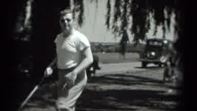Washington DC (1975): Black And White Shot Of A Man Play Golf With Cars Driving In