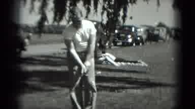 Washington DC (1975): Man Is Lining Up His Golf Swing In Front Of Several Cars