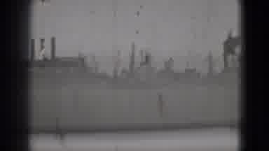 Washington DC (1975): Man And Woman Walk On Boardwalk Past Factory Opposite Of