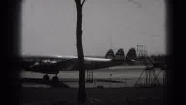 Washington DC (1975): An Airplane And A Lady Dressed Wearing A Skirt And Jacket