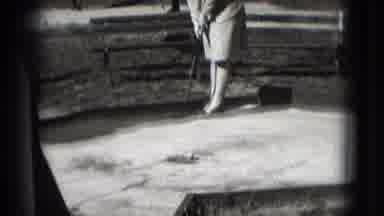 Washington DC (1975): Black And White Scene Of A Lady Playing Mini Golf Then Smile