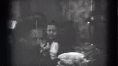 Lincoln Nebraska (1975): Person Brings White Serving Dish To A Holiday Laden