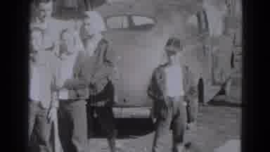 Lincoln Nebraska (1975): A Group Of Several People Gather Together To Stand And