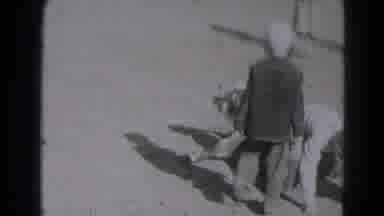 Lincoln Nebraska (1975): Several Young Kids Literally Horsing Around Outside