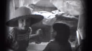 Lincoln Nebraska-1975: The Boy And Girl Are Pretend Playing At Their Home