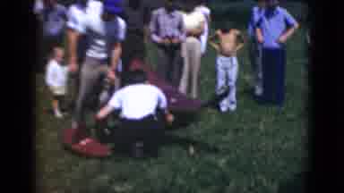 Middletown Pennsylvania (1975): A Group Of People Flying A Model Airplanes